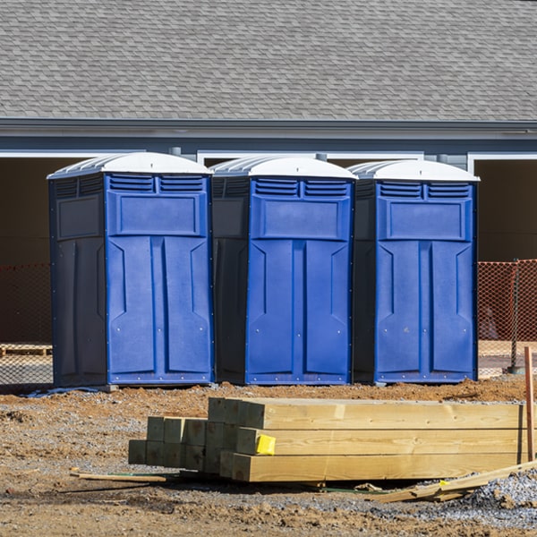 how often are the portable restrooms cleaned and serviced during a rental period in Oak Bluffs